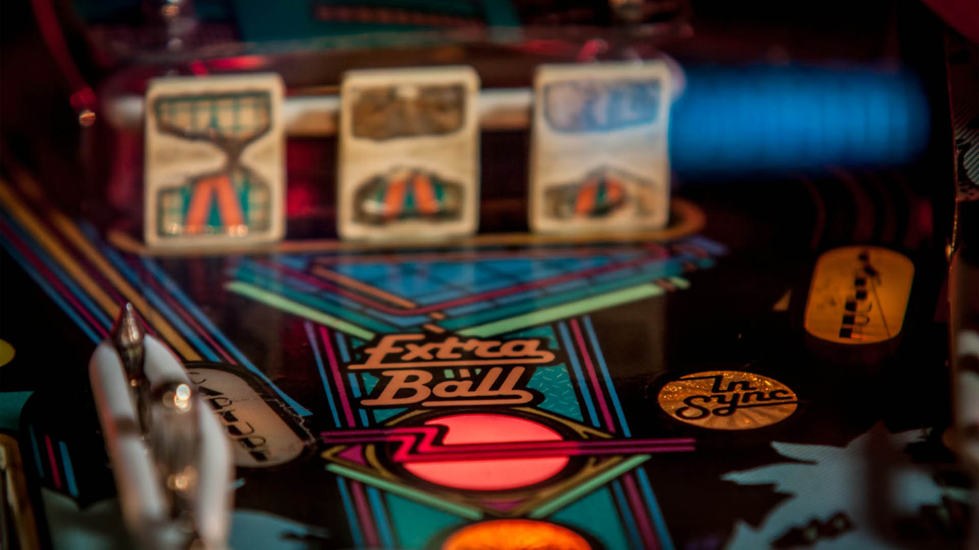A pinball play field with the words Extra Ball in focus.