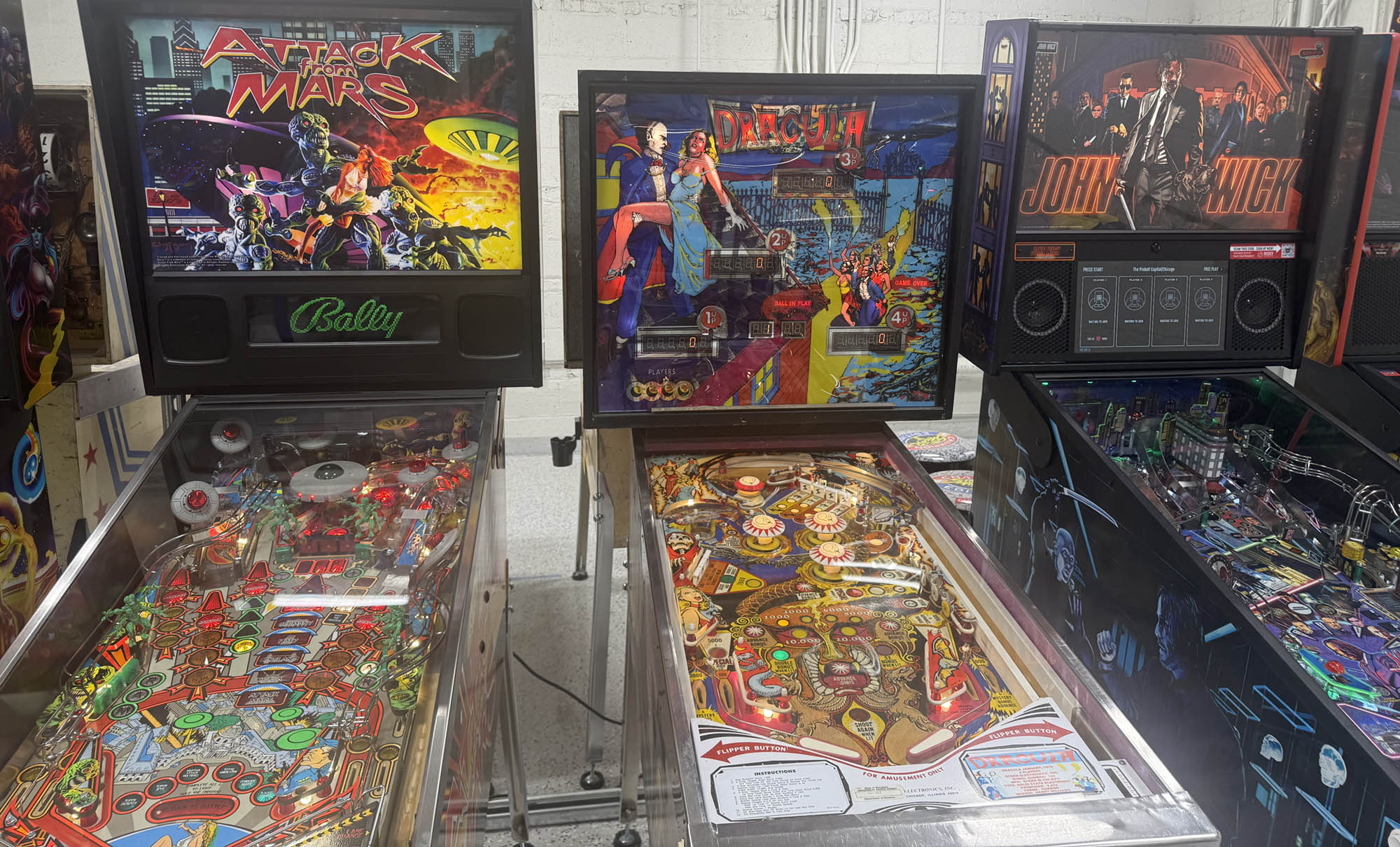 Three pinball games including Attack from Mars, Dracula and John Wick