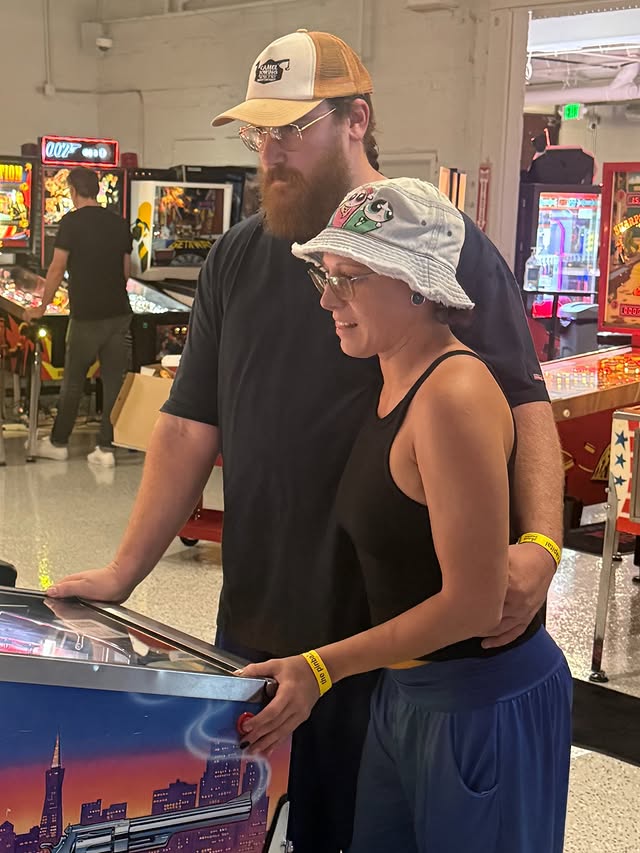 Couple Playing Pinball