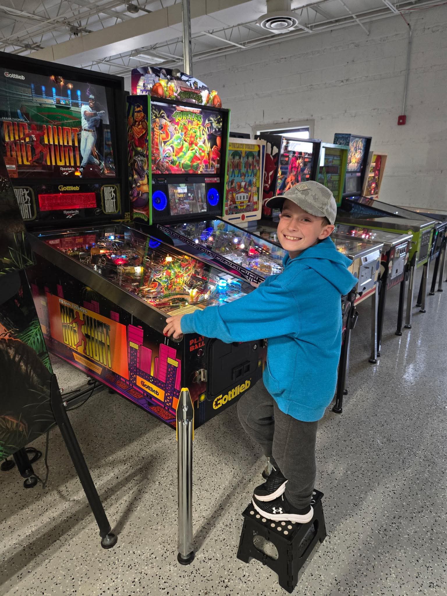 Fliptastic Youth Pinball Club - Boy Playing Pinball Machine